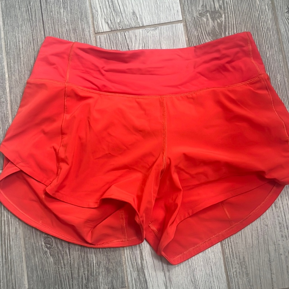 Red ish orange speed up lululemon size 4 “4” shorts